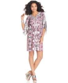 A breezy addition to your summer wardrobe: Style&co.'s dress features beautiful asymmetrical sleeves and a flattering smocked silhouette. A bold print is easy to pair with your favorite metallic sandals!