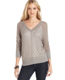 Metallic-blend yarns add sparkle to this pointelle-knit sweater from DKNY Jeans.