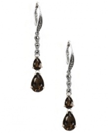 Polish your look with not one, but two, bold pops of color! Judith Jack's stunning drop earrings feature two pear-cut smokey quartz drops (3-5/8 ct. t.w.) and glittering marcasite (1/5 ct. t.w.). Set in sterling silver. Approximate drop: 1-3/4 inches.