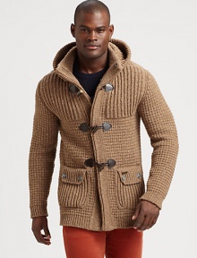 Made in Florence from the finest tweed yarn, this extra-chunky knit sweater has a removable hood and horn toggles, so it can double as a coat.Button-frontAttached hoodWaist flap pocketsRibbed knit cuffs and hemAbout 29 from shoulder to hem80% wool/20% nylonHand washMade in Italy