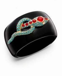 Add sleek, serpentine design to your look. A hot new trend made popular by celebrities like Angelina Jolie, snake jewelry adds a wild element to your style. This Kenneth Jay Lane cuff features a black enamel surface studded with turquoise-colored glass stones and ruby-red beads. Set in gold tone mixed metal. Approximate diameter: 2-1/4 inches.