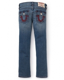 This gently faded True Religion skinny jean features unique red logo and floral embroidery on the back pockets.