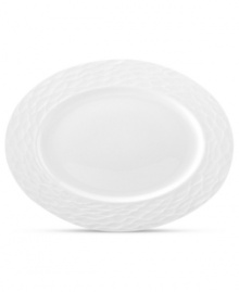 Set the tone with the white bone china of Devore dinnerware. A matte, organic texture lends chic distinction to an oval platter that's equally suited for fine dinner parties and every day of the week. From Donna Karan by Lenox.