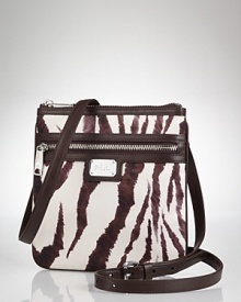 Hit print with this nylon crossbody bag from Lauren by Ralph Lauren, boasting bold stripes, leather finishes and a just right size.