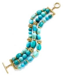 The vibrant look of turquoise overtakes this lovely bracelet from Lauren Ralph Lauren. The three-row design showcases reconstituted turquoise beads and open work metal accents. Ring and toggle closure. Crafted in 14k gold-plated mixed metal. Approximate length: 7-3/4 inches.