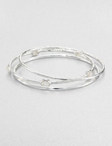 From the Rock Candy® Collection. A trio of hammered, sterling silver bangles accented with faceted mother-of-pearl. Sterling silverMother-of-pearlDiameter, about 2.5Slip-on styleImported 