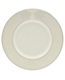 Sprinkled with subtle, stylized florals and wrapped in polished platinum bands, this salad plate brings refined whimsy to your formal table in creamy fine bone china.