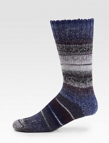 A thick wool blend, in soft, multicolored stripes is an ideal choice to wear under your winter boots for all day comfort.Mid-calf height52% wool/46% acrylic/1% elastane/1% polyamideMachine washImported