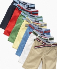 Warm up his wardrobe with a pair of Tommy Hilfiger slim-fit flat-front shorts that make it easy to get styled for summer fast.