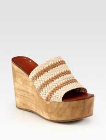 Artfully crafted woven leather upper joined by an earthy wooden wedge and platform. Wooden wedge, 4 (100mm)Wooden platform, 2 (50mm)Compares to a 2 heel (50mm)Woven leather upperLeather liningRubber soleImported