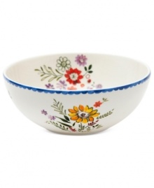 Freshen up. Colorful wildflowers scatter inside and out on the Scallop Floral serving bowl, a charming addition to country settings from Marcela for Prima Design. With dainty blue trim.