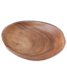 A real natural, the Acacia Wood salad plate celebrates the earth's bounty with a rich grain and russet-brown hue. By Marcela for Prima Design.