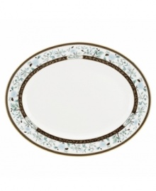 Extraordinarily detailed yet amazingly dishwasher safe, the Palatial Garden oval platter from Marchesa by Lenox combines teal blossoms, intricate gold vines and velvety brown accents in gold-banded bone china for unparalleled elegance.