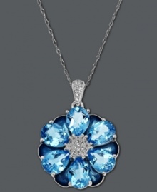 Fresh from the garden. Town & Country's fabulous flower pendant shines with the addition of pear-cut blue topaz (13-1/2 ct. t.w.) and a white topaz (1/2 ct. t.w.) center. Crafted in sterling silver. Approximate length: 18 inches. Approximate drop: 1-1/4 inches.