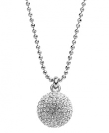 On the ball. This trendy long pendant by Michael Kors puts the chic back into disco with pave-set crystal accents and a silver tone mixed metal setting. Pendant strung from a ball chain with a toggle clasp and MK lock charm. Approximate length: 32 inches. Approximate drop: 5/6 inch.