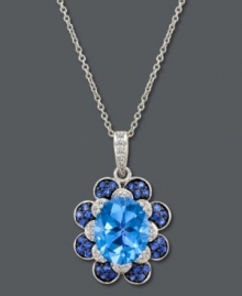 A true blue sensation. Le Vian's cool pendant features a beautiful flower shape with an oval-cut blue topaz at center (3-9/10 ct. t.w.) surrounded by petals decorated with diamonds (1/10 ct. t.w.) and sapphires (1/3 ct. t.w.). Set in 14k white gold. Approximate length: 18 inches. Approximate drop: 1 inch.