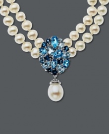 Two rows of shimmer and shine. This polished style features pear-cut blue topaz (4 ct. t.w.), sparkling white topaz accents and strands of cultured freshwater pearls (8 mm x 10mm). Set in sterling silver. Approximate length: 17 inches. Approximate drop: 1-1/4 inches.