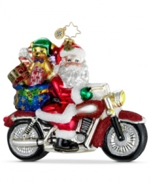 A wild sight: Santa Claus puts pedal to the medal, rocking a cherry-red hog in this whimsical ornament, handcrafted by Christopher Radko. Teddy takes a back seat, wearing a special bear-sized helmet.