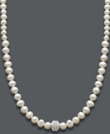 Shimmer and shine. Cultured freshwater pearls (6-8 mm) and a sparkling crystal-accented ball make for an elegant combination on this stunning strand necklace. Approximate length: 18 inches.