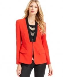 Vince Camuto crafts a bold blazer with a collarless silhouette and a contrasting faux lapel.