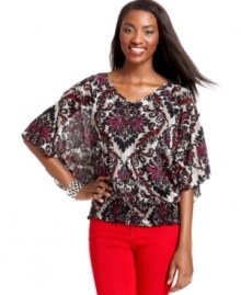 This modernized peasant top from Style&co. features cute butterfly sleeves with ruffled cuffs and a fabulous lace yoke detail at the back.