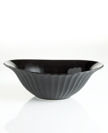 Into the black. Fluted borders commingle with contrasting matte and glossy glazes, giving this distinctive vegetable bowl from Sasaki a decidedly modern allure.