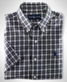 Cut for a relaxed, classic fit, a short-sleeved sport shirt is crafted from crisp cotton poplin in traditional tartan plaid for an authentic look.