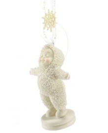 Let it snow! A sweet Snowbaby enjoys the snow in this lovely ornament from Department 56, bringing the lasting holiday tradition to your home this season. Crafted of pure porcelain bisque.