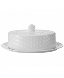 Nantucket Basket is a fine, all-white Wedgwood china dinnerware and dishes pattern with an embossed basket-weave pattern on the edges. Shown at back left.