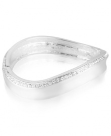 Make waves with this hinged bangle bracelet from Robert Lee Morris. Crafted from silver-tone mixed metal, the piece gets a lustrous addition by way of glass pave crystal accents. Approximate diameter: 2-3/8 inches.