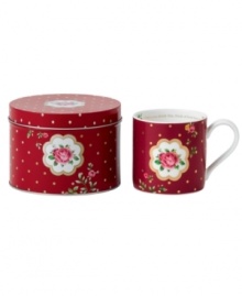 Royal Albert offers a festive twist on the iconic Old Country Roses pattern with a holiday mug mixing shiny gold dots with pink and gold florals. A message about love inside and coordinating tin make it a great gift.