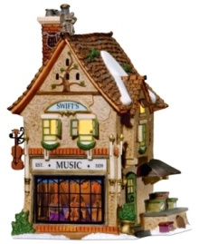 With its whimsical detailing and bright coloring, Swift's Stringed Instruments is a delightful building that helps keep the music alive at Christmastime. Crafted of hand-painted porcelain and part of the Dickens' Village from Department 56.