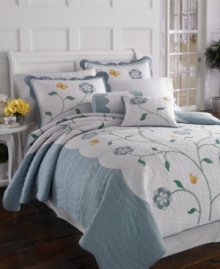 The Butterfly Meadow quilt features a centered, whimsical florals and bright yellow butterflies across lofty quilting. With soft scalloped borders, this nature-inspired quilt is the perfect bedding solution for breezy spring and summer nights.