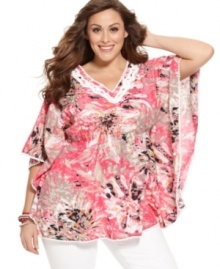 Showcase a fresh look this spring with Style&co.'s batwing sleeve plus size top, cinched by a smocked waist.