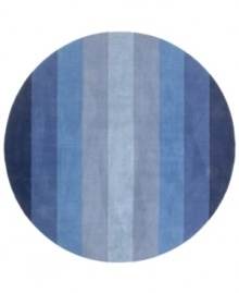 Hand-tufted, blended wool gives an exceptionally soft feel to this rug from the Coastal Treasures collection. In a shimmering, striped design of ocean-blue colorways, this sophisticated piece adds serene character to every decor.