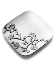 An artful interpretation of the cherry blossom, beautifully embossed in metal, adds springtime charm to any gathering. This radiant tray from Wilton Armetale is crafted in durable and rust-free aluminum alloy that resists chips and dents. Can be used in the oven or the freezer, so it's perfect for bringing straight to the table from the kitchen.