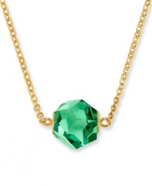 Look perfectly glamorous in green. Swarovski's eye-catching Erinite crystal in an exclusive cut forms the centerpiece of this unique design. Crystal hangs from a gold tone mixed metal chain. Approximate length: 14-7/8 inches. Approximate drop: 1 inch.