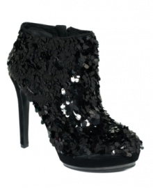 Vince Camuto's Dira platform booties feature all-over sequins for a look that's as festive as it is luxurious.