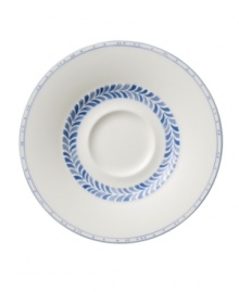 Vintage charm meets modern durability in the Farmhouse Touch tea saucer, featuring cornflower-blue laurels and bands in premium porcelain from Villeroy & Boch.