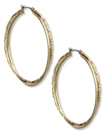 Fashion with a twist. Jones New York's double hoop earrings lend vintage appeal. Crafted of worn gold tone mixed metal. Approximate diameter: 1 inch.