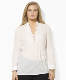 A prettily pin-tucked plus size tunic is elegantly crafted in airy cotton voile and finished with graceful button and loop closures for a romantic flourish, from Lauren by Ralph Lauren.