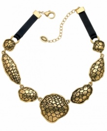 Ssseriously ssstylish! Embossed python adds an exotic edge to this striking statement necklace from T Tahari's Python Collection. Adorned with sparkling light Colorado crystals and leather trim, it's crafted in antique gold tone mixed metal. Approximate length: 17 inches + 3-inch extender.