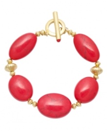 Revive your style. Lauren by Ralph Lauren's bold and bright design features reconstituted coral beads. Setting and toggle clasp crafted in gold tone mixed metal. Approximate length: 8 inches.