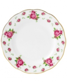 Revive a classic dinnerware pattern with the Vintage bread and butter plate. Lush pink blossoms plucked from the Old Country Roses collection flower on white bone china with a ruffled gold edge.