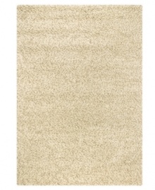 Throw it in neutral. This natural-toned area rug by Couristan is created by blending different thicknesses of soft wool yarn, blissfully plush with an ultra-thick pile that's rich in both texture and tone.