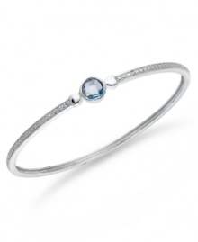 Bangle love. You'll adore Victoria Townsend's stunning sterling silver bangle with its pretty round-cut blue topaz (1-1/2 ct. t.w.) and sparkling diamond accents. Approximate circumference: 8 inches.