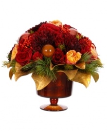 Introduce a colorful, festive accent to your table or mantel with this holiday centerpiece from Winward. Offering several blossoms in a warm colorway, it is sure to liven up the wintry months with beauty.