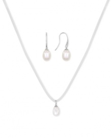 Casual chic. This pendant and earrings set from Majorica pops with organic man-made pearls (9 mm). The ivory-colored cord necklace adds a touch of whimsy. Crafted in silver tone mixed metal. Approximate length: 16 to 18 inches. Approximate drop: 1/2 inch.