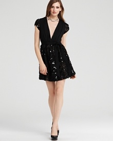 This Mark + James cap-sleeve dress boasts a seriously charming silhouette finished with a sparkling sequin-adorned skirt.