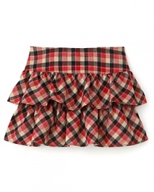 Perfect with a button down shirt, long sleeve tee or cardigan, this season-right Juicy Couture plaid skirt refreshes the classic style with tiered ruffle styling.